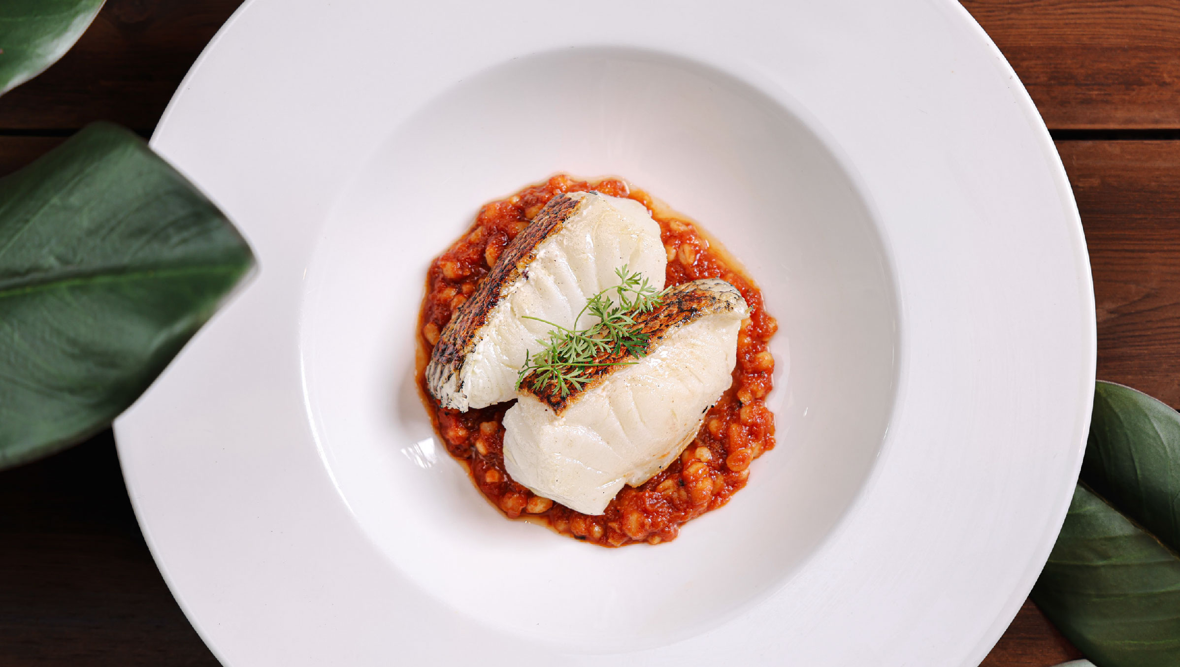 Pan-seared Daily Catch with Tomato Concassé, Pearl Barley, Water Chestnuts and Aged Mandarin Peel